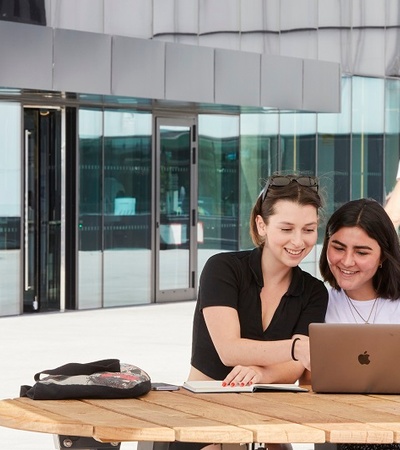 IE Students with a computer at IE Tower
